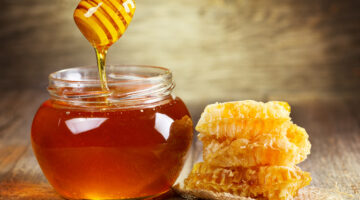 jar of honey with honeycomb